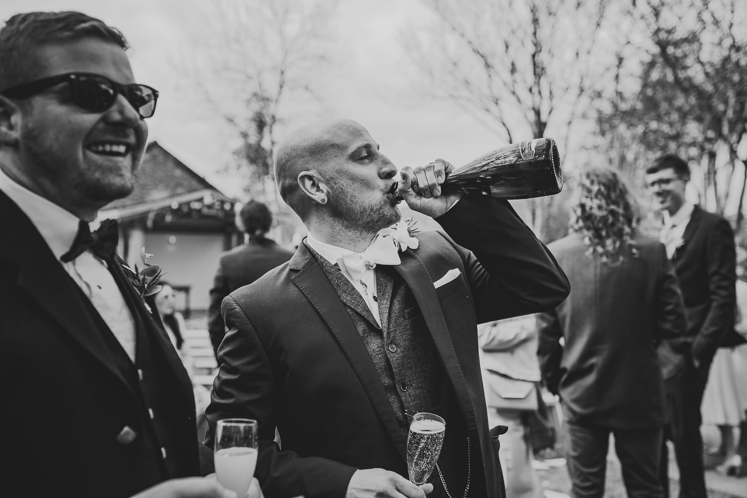 Groom drinking champagne